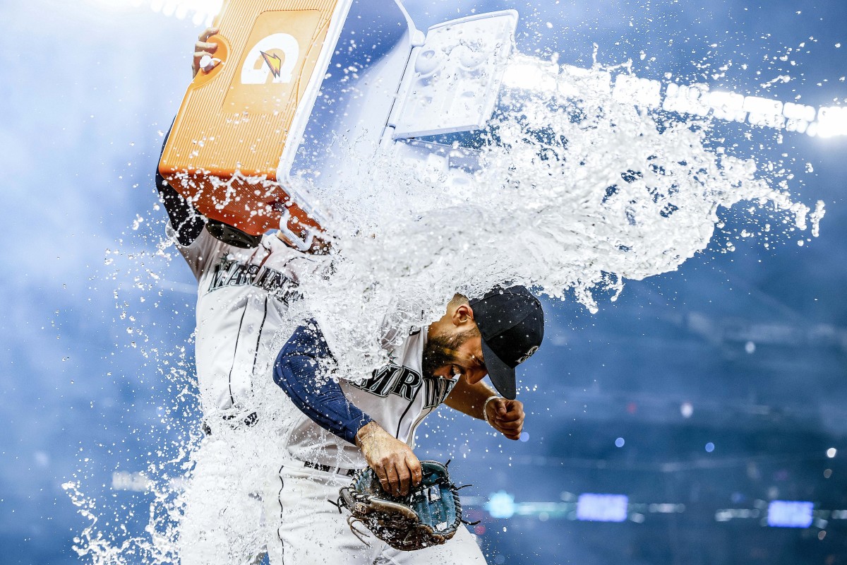 Abraham Toro gets dosed with a cooler of water after hitting a game-winning grand slam off Astros reliever Kendall Graveman on Aug. 31. The Mariners traded Graveman for Toro just over a month earlier.